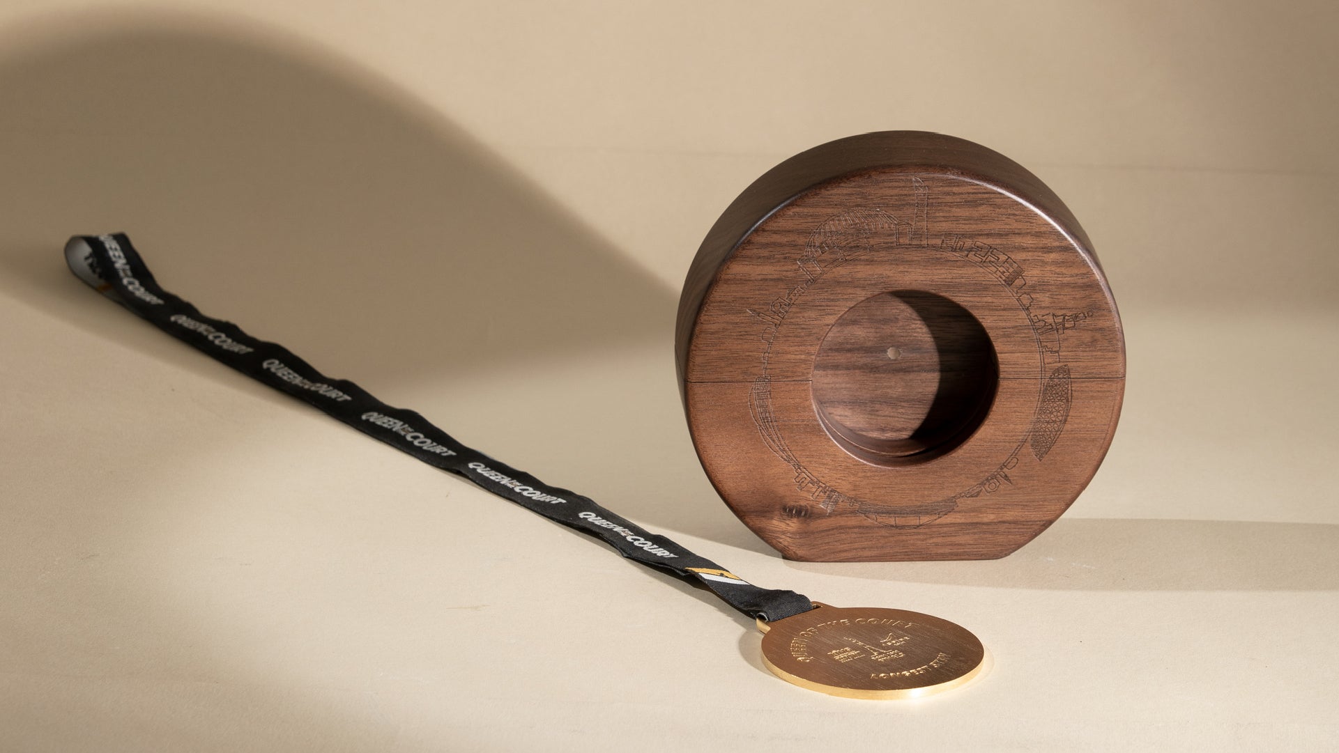 Empty wooden design piece with the golden metal laid beside it