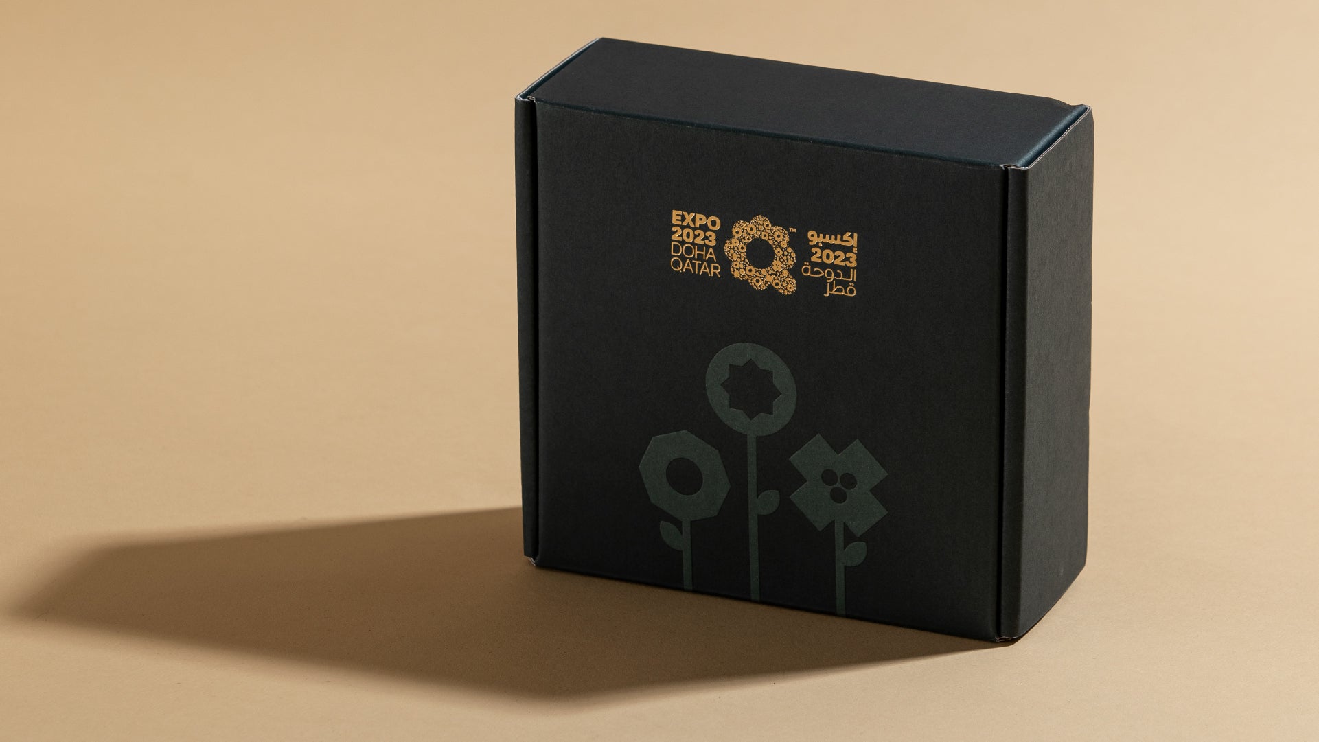 The container made for the calendar, with gold foil and hard pressed details on top