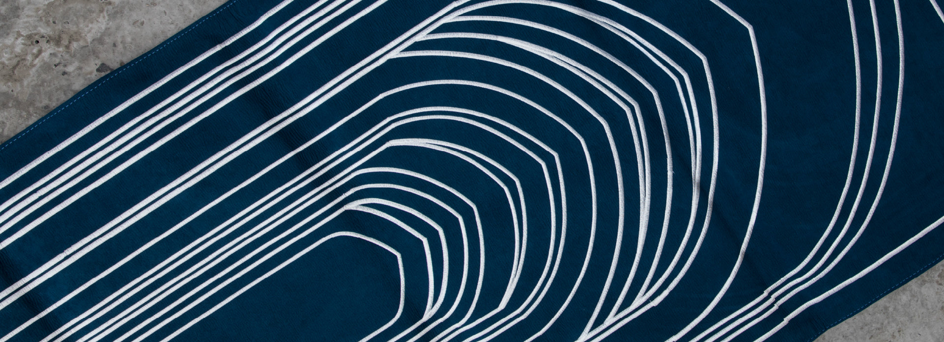 Focus on the intricacy of the praying carpet in the header image of the page