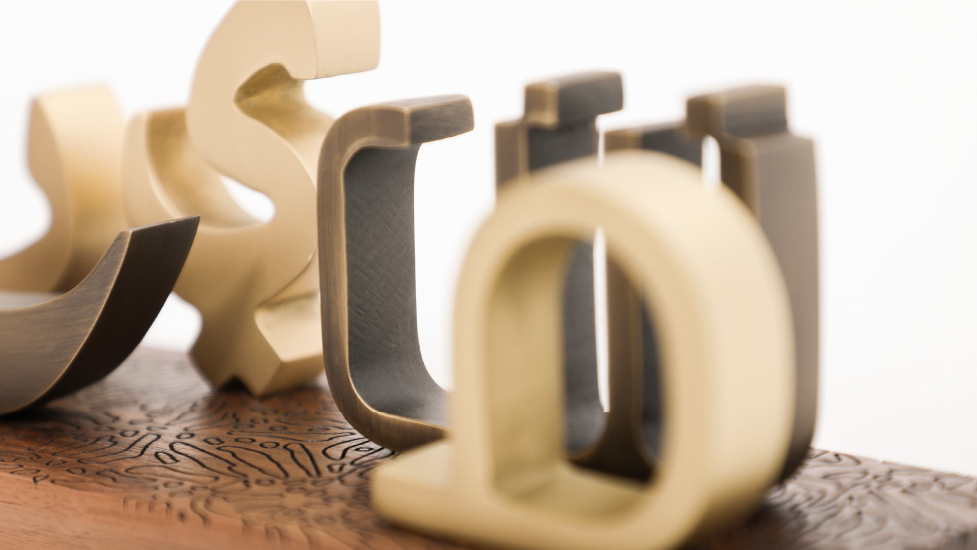 Zoom and lens camera focus on some of the letter of the paperweight set