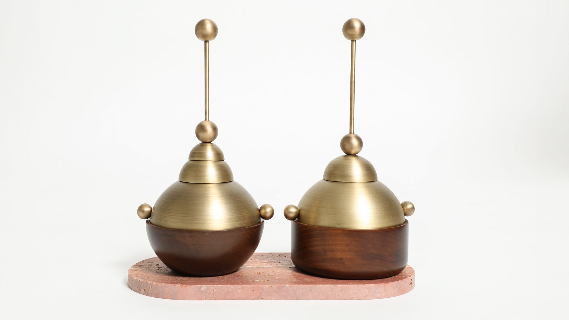Two incense burners in their form variant, one circular and the other squared, on top of ceramic stand