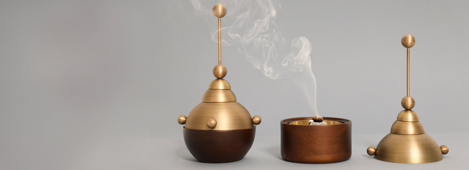 The header of the business section of the Misbah incense burner showing smoke and the design piece