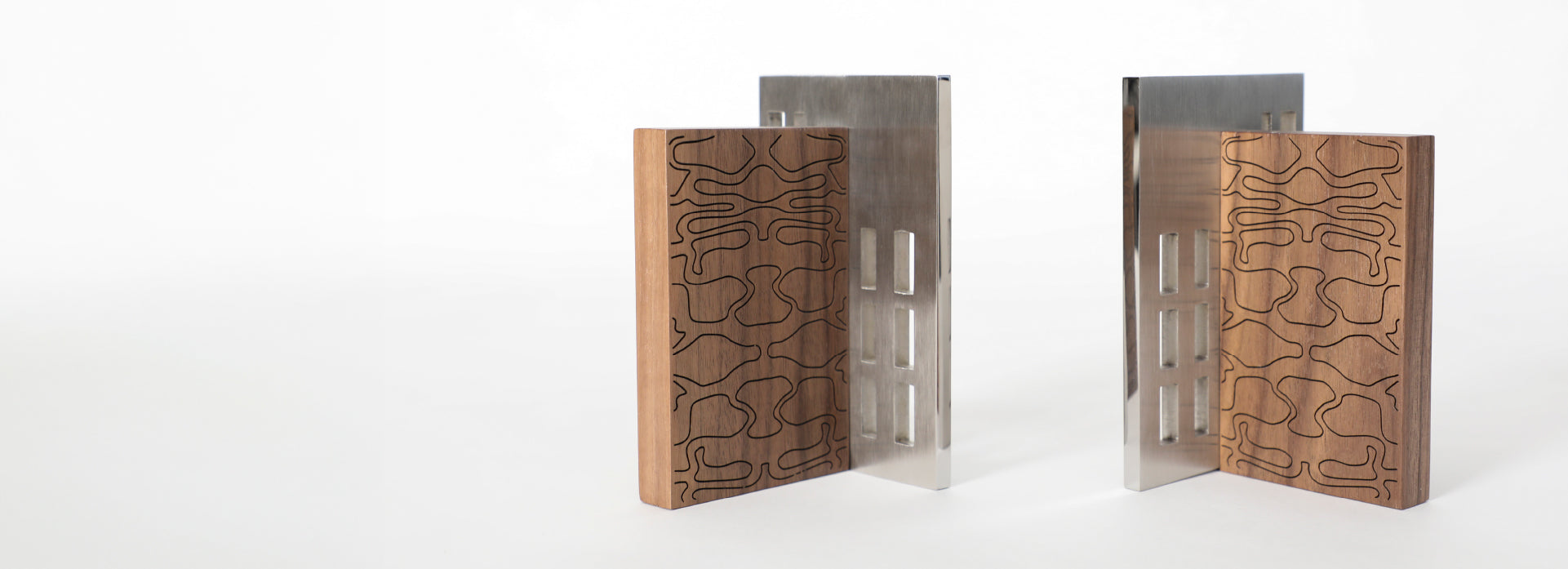 The design piece divided into two, with their wooden and metal parts visible on the right