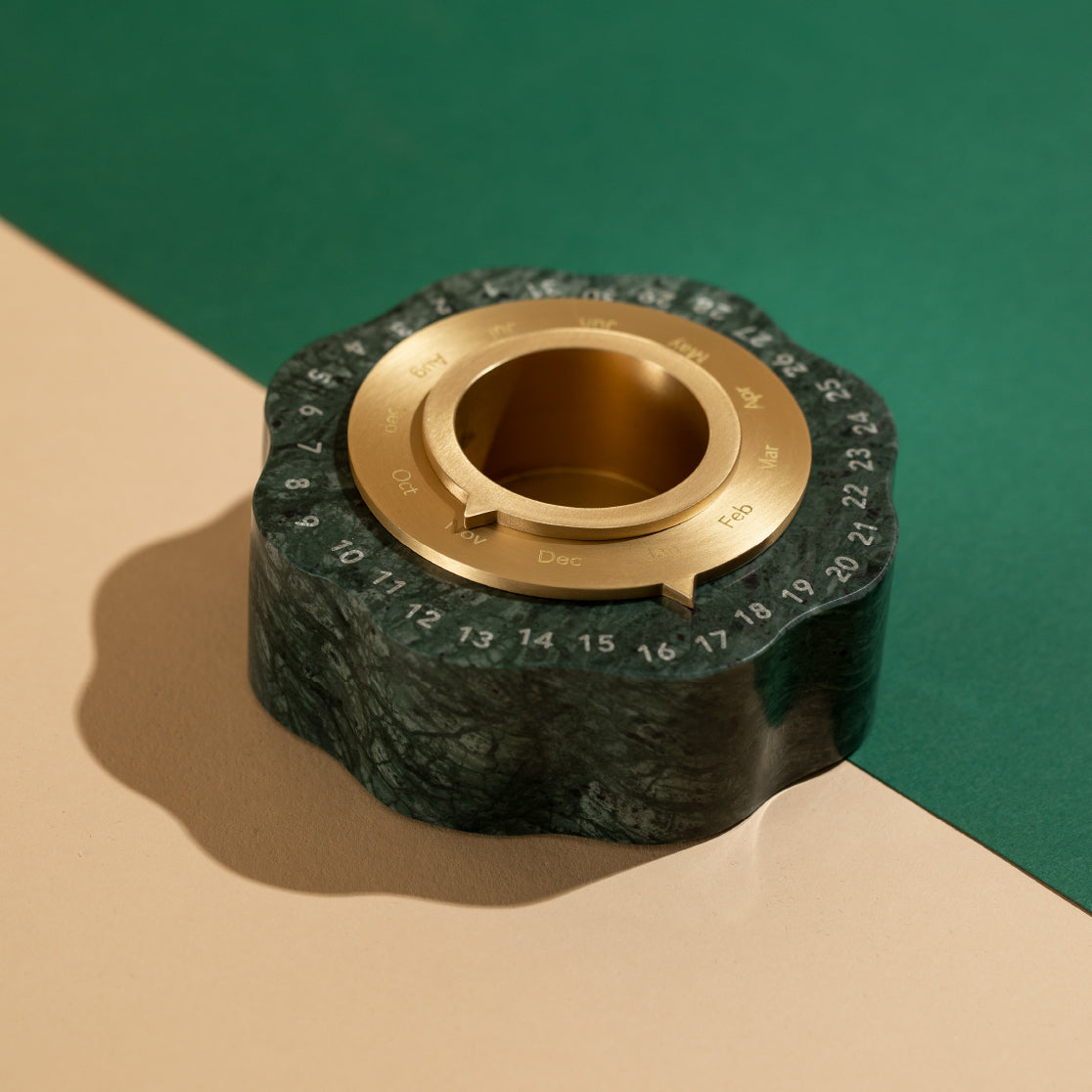Front top view of the design piece resting on a green and ochre colored table