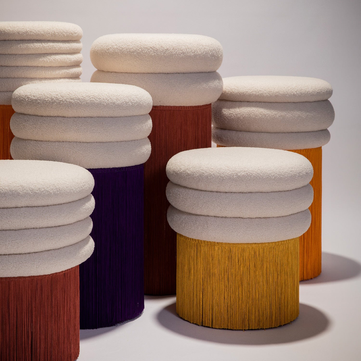 The entirety of the stools in the Tessels Collections, in their different colors and heights