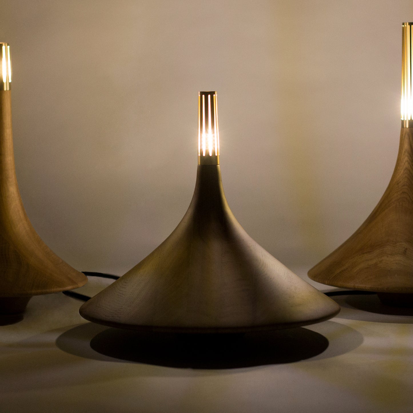 Wood design pieces in walnut colors in the Dervich Lighting collection