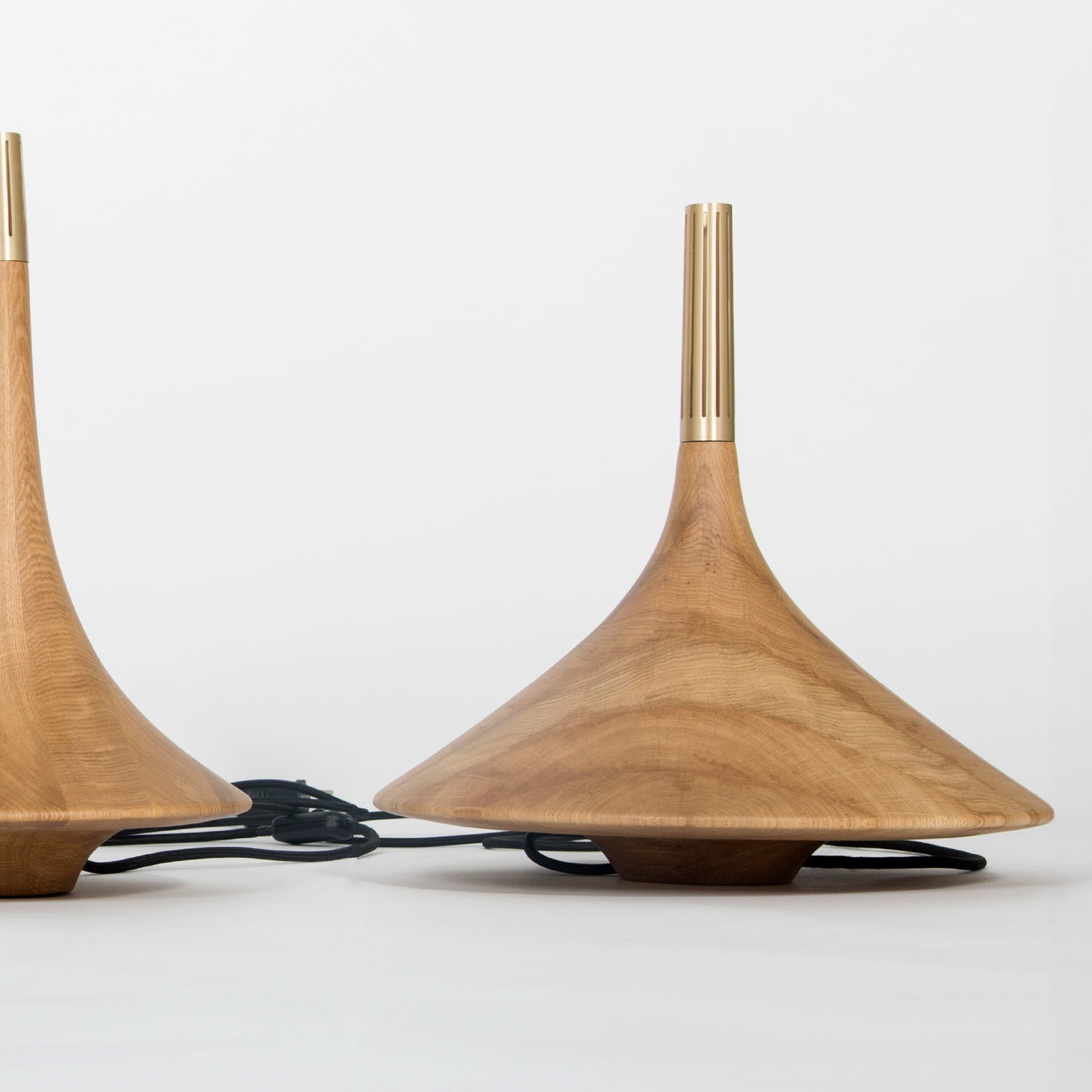 Two wood design pieces in light brown colors in the Dervich Lighting collection