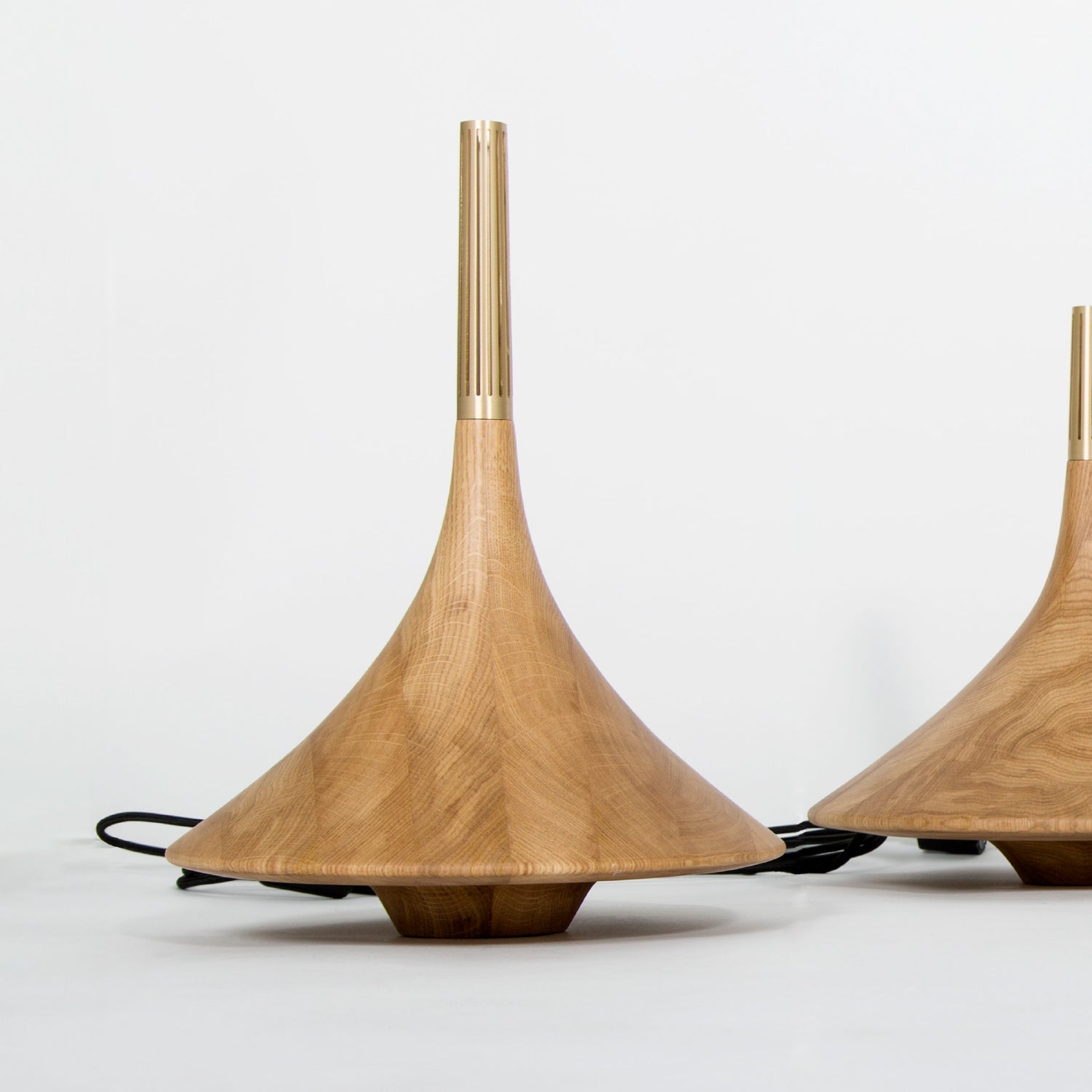 Two wood design pieces in light brown colors in the Dervich Lighting collection